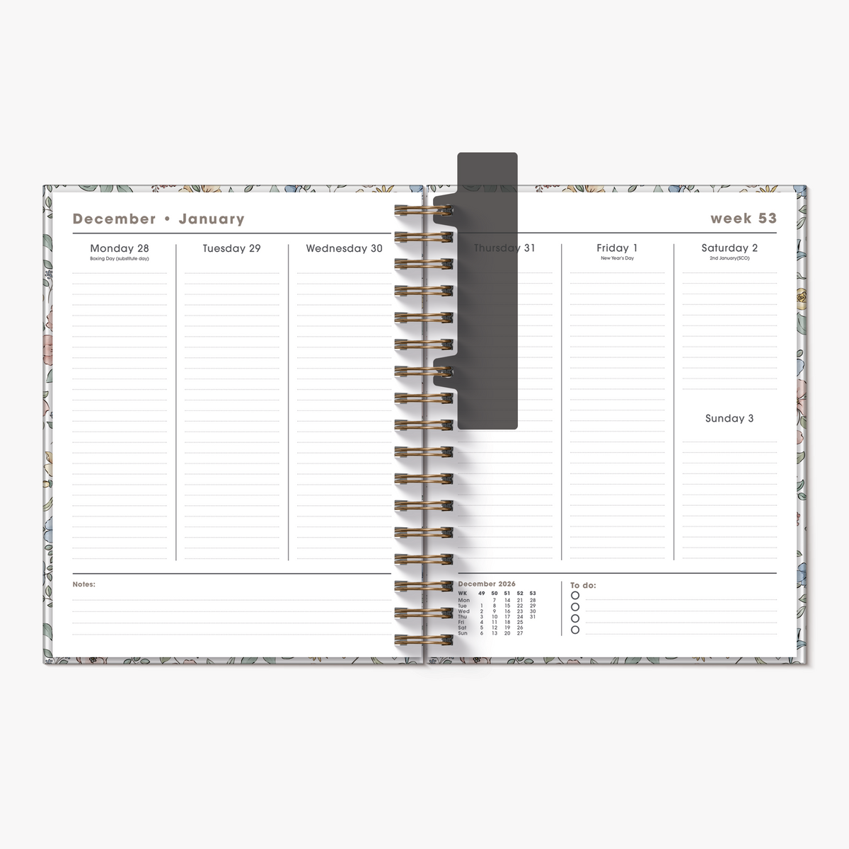Spiral-bound luxury weekly planner 2027 in the A5+ size featuring small flowers in pastel shades – inside pages with weekly overview.