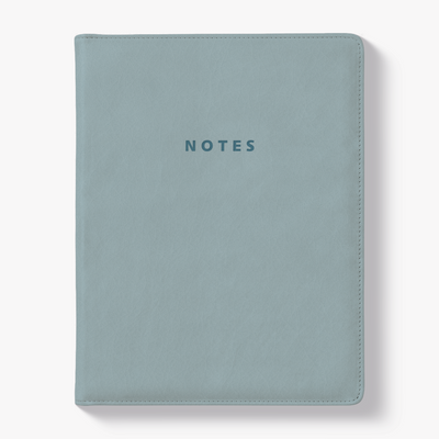 Notebook with a flexible leather-look cover sleeve in a duck egg blue tone – front view.