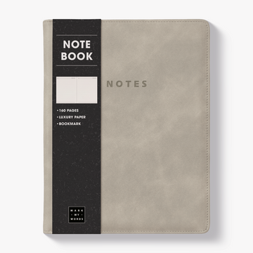 Notebook with a flexible suede-look cover sleeve in warm beige – front view with informative paper wrap.
