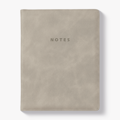 Notebook with a flexible suede-look cover sleeve in warm beige – front view.